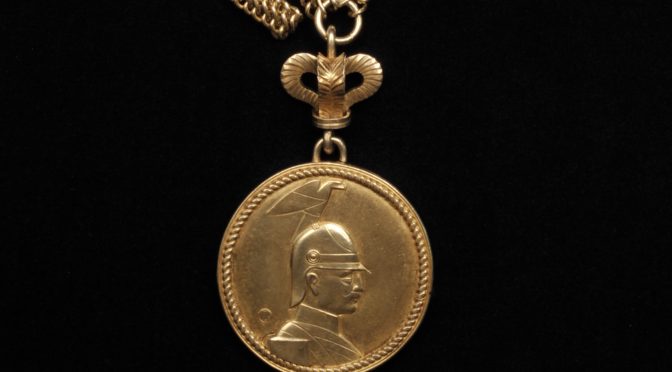 Photo of a medallion bearing the profile portrait of Emperor Wilhelm II.